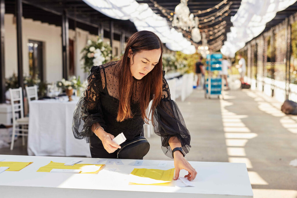 Person coordinating the registration table at an event.