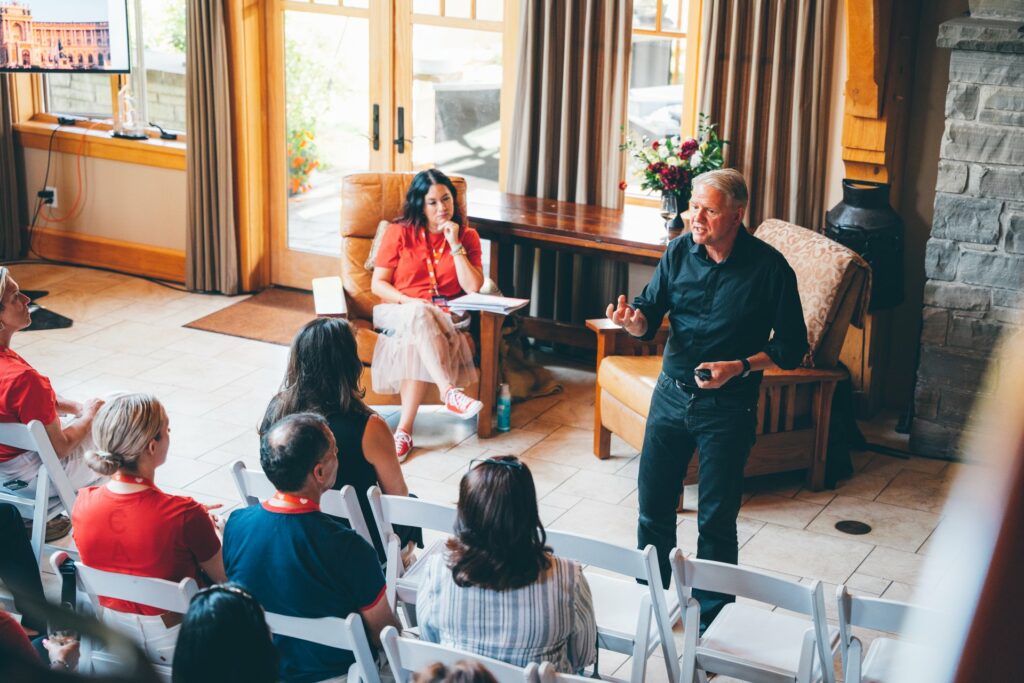 Person speaking in front of an audience at a literary event.